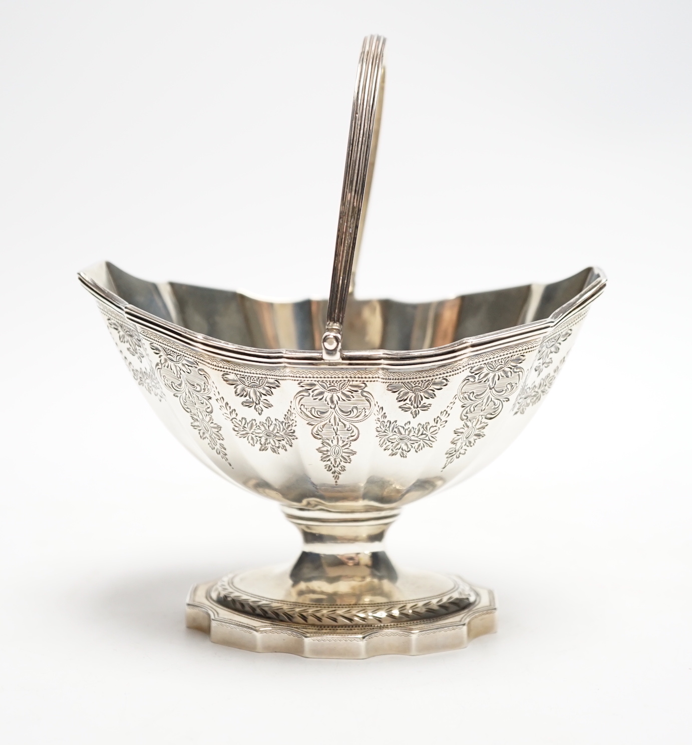 A George III silver boat shaped pedestal sugar basket, John Hutson, London, 1788, length 13.2cm, 5.6oz.